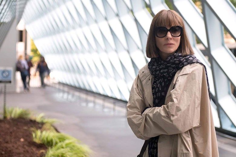 Cate Blanchett stands with her arms crossed in a hallway in this still from Where’d You Go Bernadette