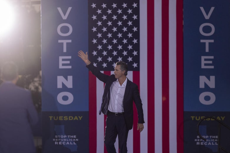 California Gov. Gavin Newsom walks onstage at a "Vote no" rally. 