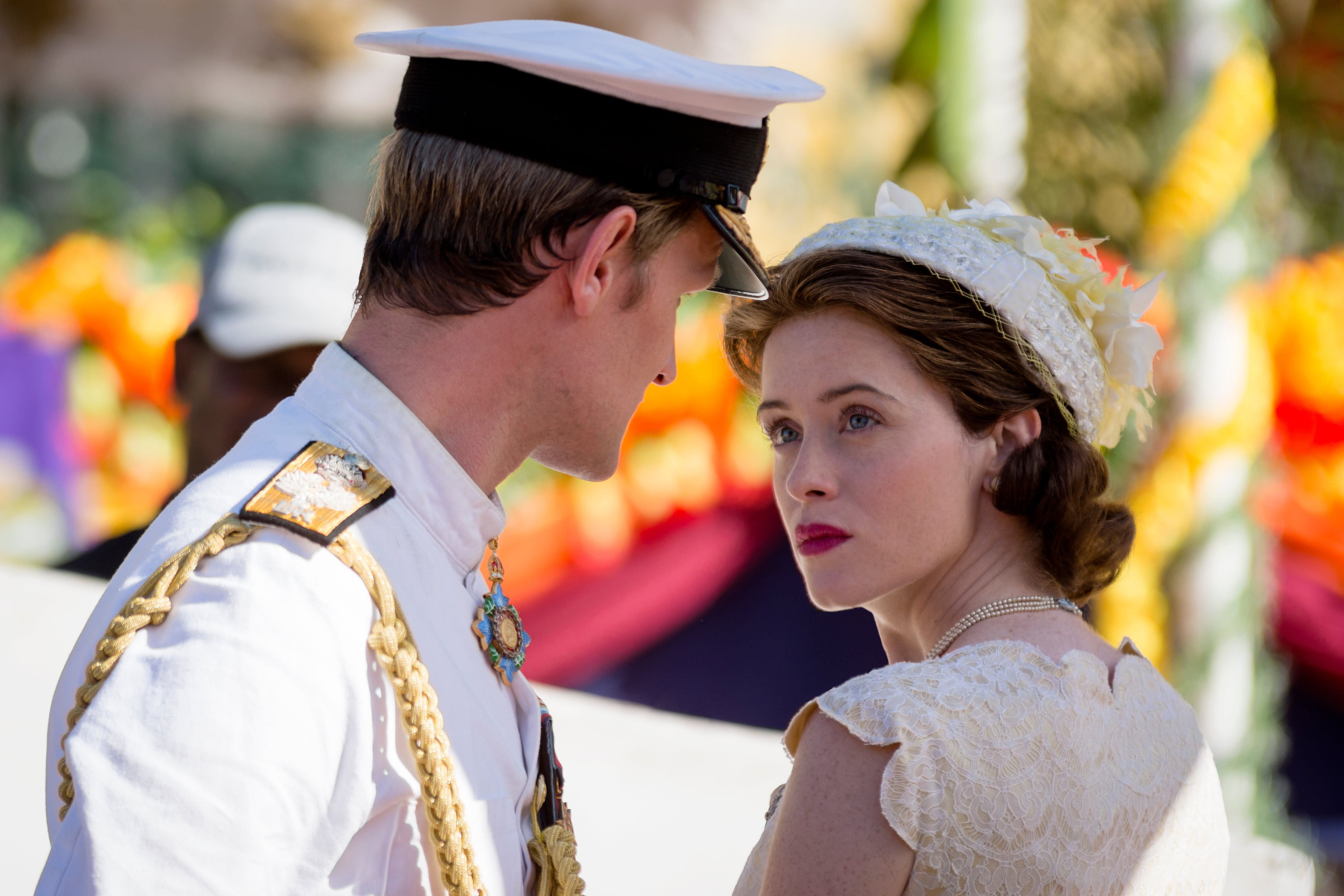 Matt Smith and Claire Foy stare into each others' eyes, not smiling, in The Crown.