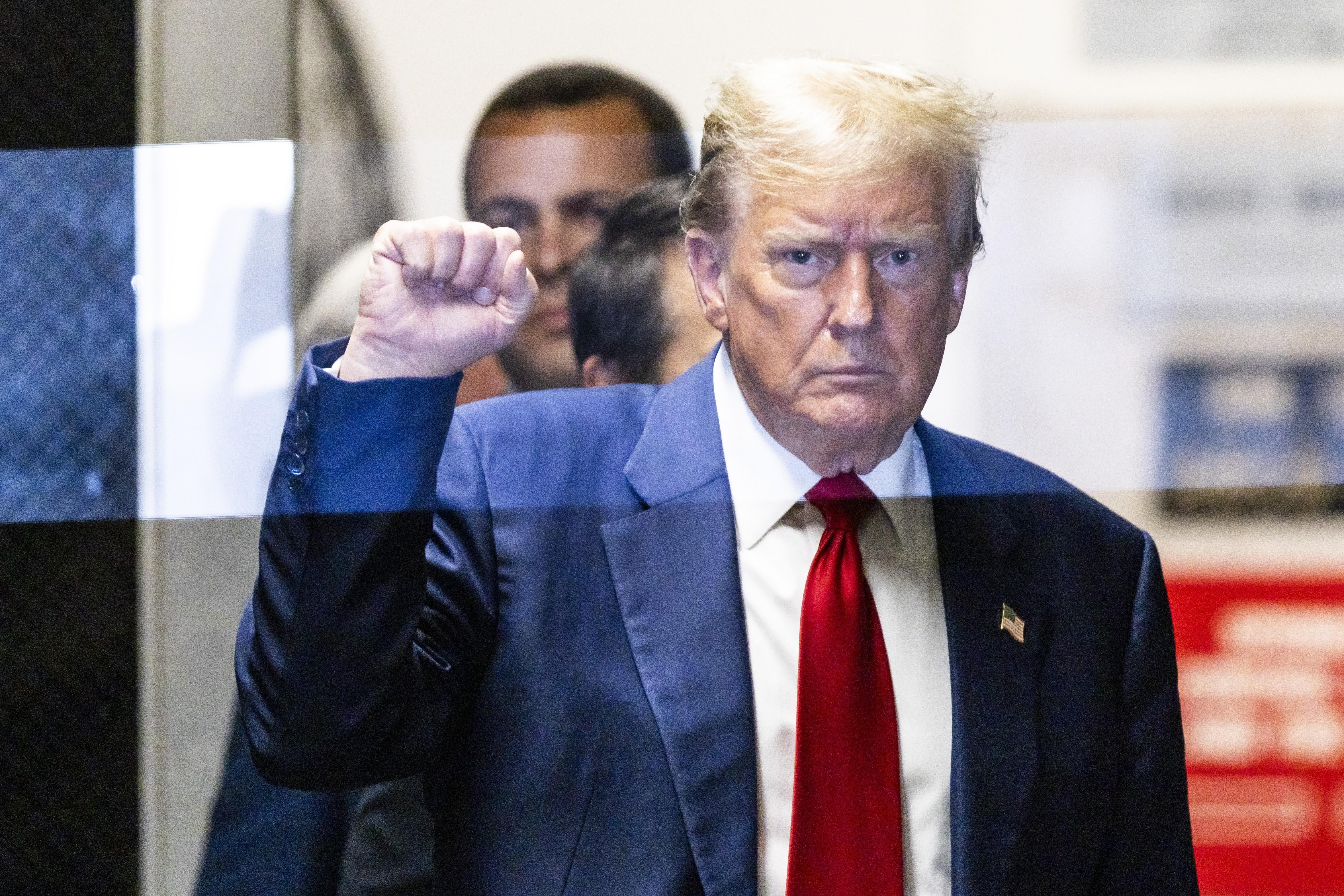 Former U.S. President Donald Trump returns to the courtroom after a lunch break during his trial for allegedly covering up hush money payments at Manhattan Criminal Court on April 30, 2024 in New York City. 