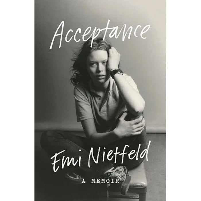The cover of the book, showing a teenage girl with her legs crossed seated on a chair, leaning her head in her hand and looking to the side into the middle distance