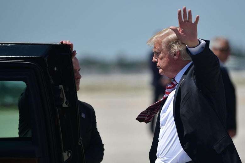 President Donald Trump steps off Air Force One upon arrival at Palm Beach International in West Palm Beach, Florida on April 18, 2018. 