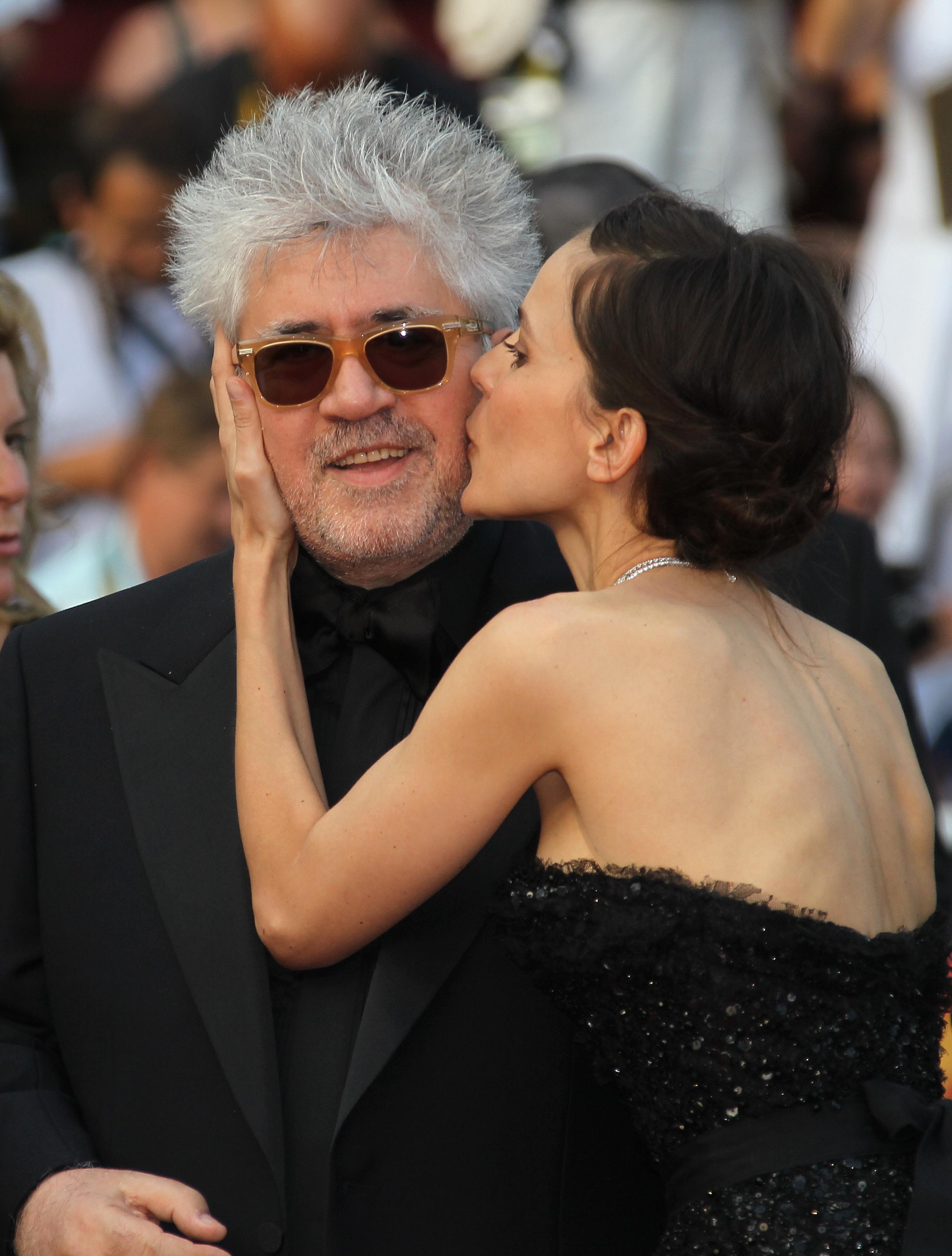 Elena Anaya kisses Pedro Almodovar before a screening of The Skin I Live In at Cannes in May.