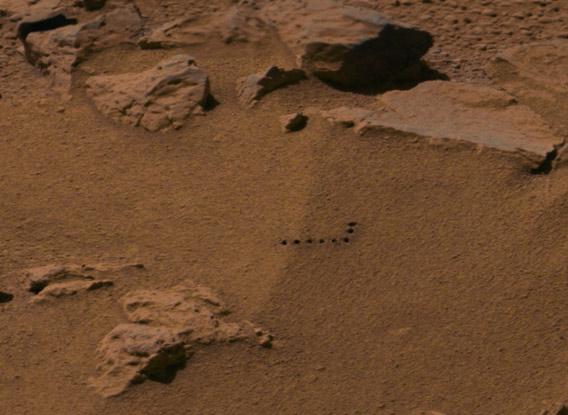 Laser-zapped holes in the Martian surface.