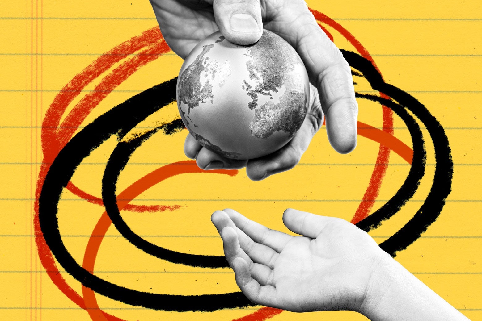 Adult's hand passing a mini globe to a child's hand.