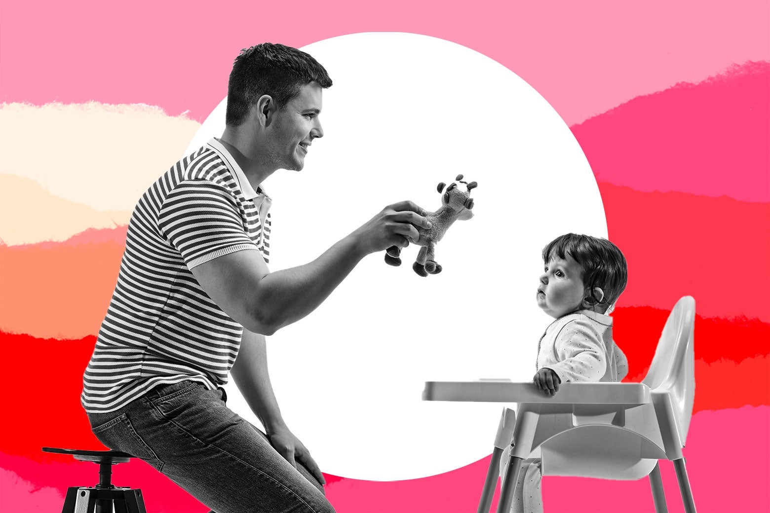 A father holds up a stuffed giraffe toy in front of a baby in a highchair