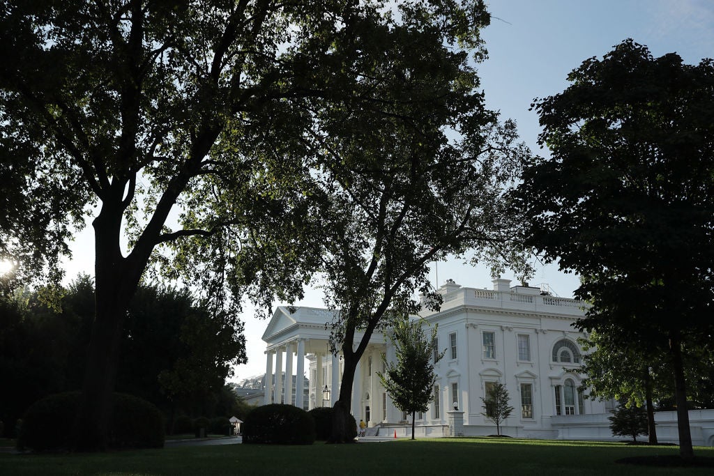 An exterior shot of the White House in early morning light.