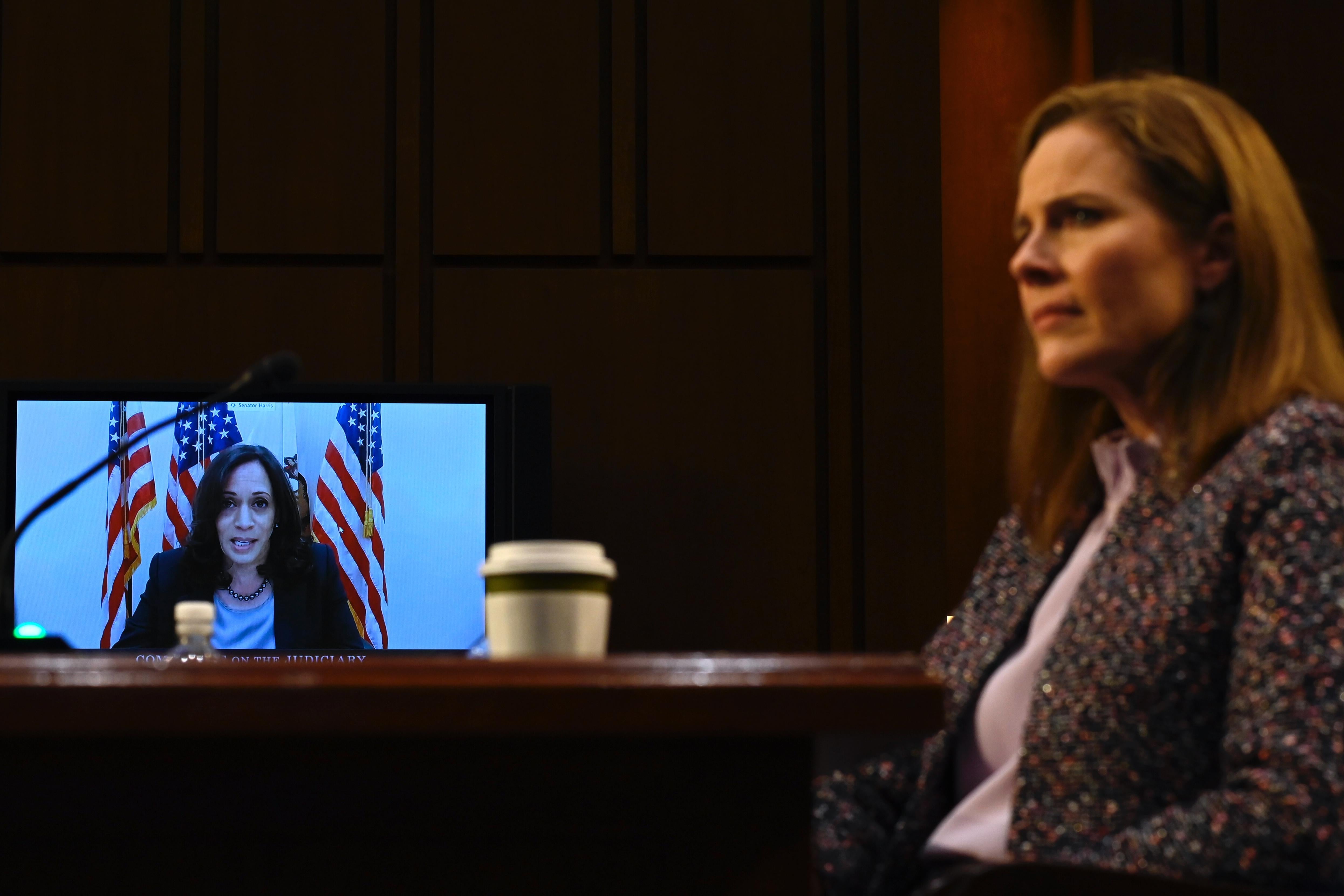 Sen. Kamala Harris on a video screen questioning Supreme Court nominee Amy Coney Barrett.