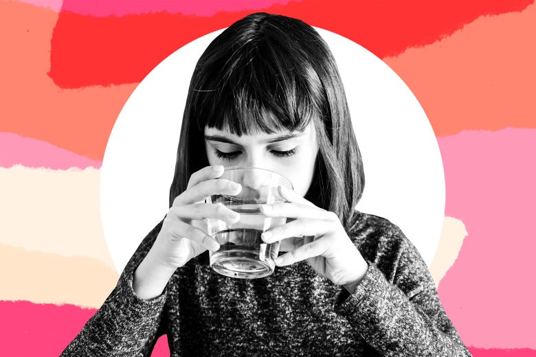 Photo illustration of a girl drinking out of a clear cup.