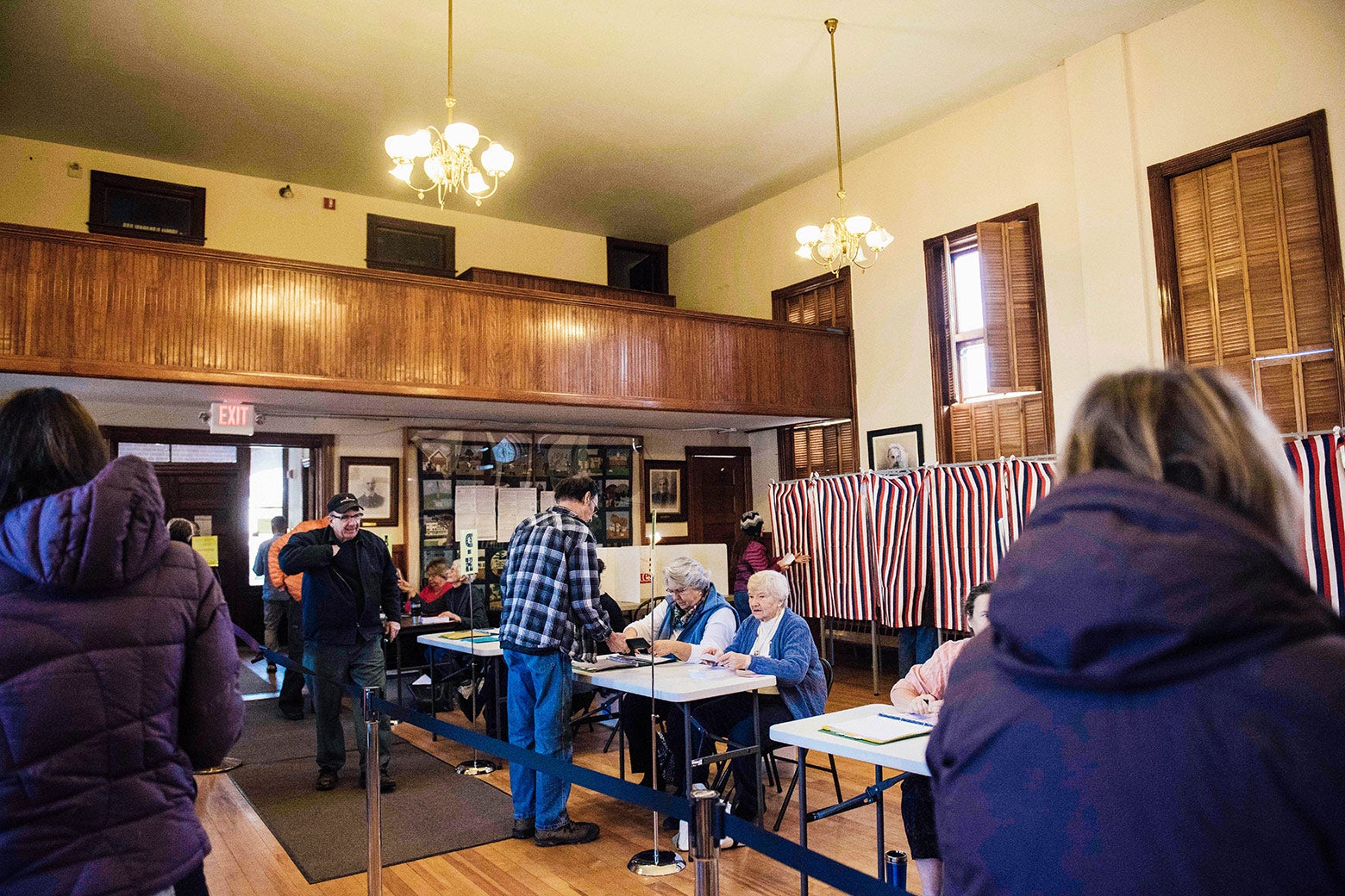 Voters cast their ballots in the presidential election at the Sutton town hall on Nov. 8, 2016, in New Hampshire.