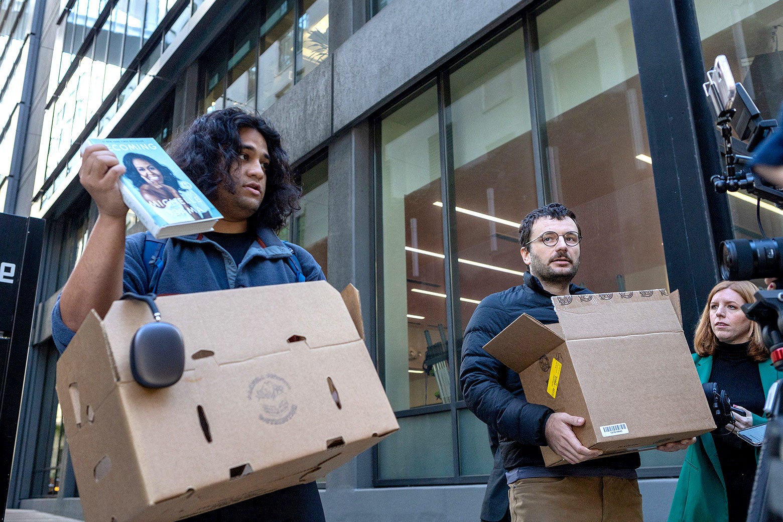 The two pranksters—"Ligma and Johnson"—who claimed to be laid-off Twitter workers. They are walking outside of the company's building in San Francisco carrying boxes off possessions.