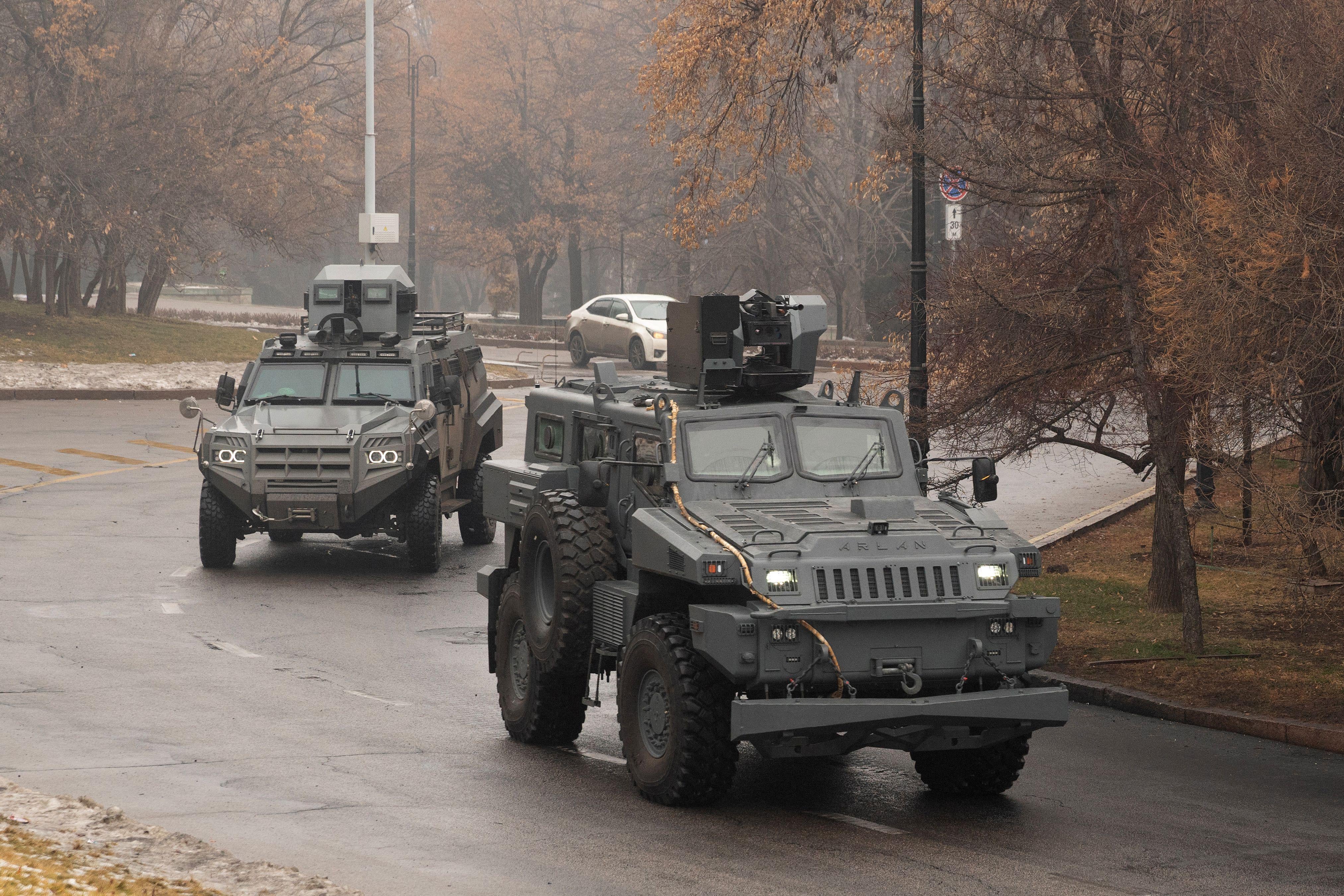 Military vehicles patrol streets in central Almaty on January 7, 2022, after unprecedented unrest in the Central Asian nation due to a hike in energy prices. 