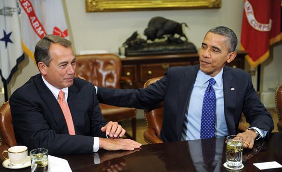 President Barack Obama sits with Speaker of the House John Boehne.