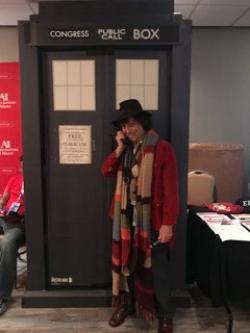 The Fourth Doctor of Doctor Who uses the TARDIS to call Congress and support net neutrality. 