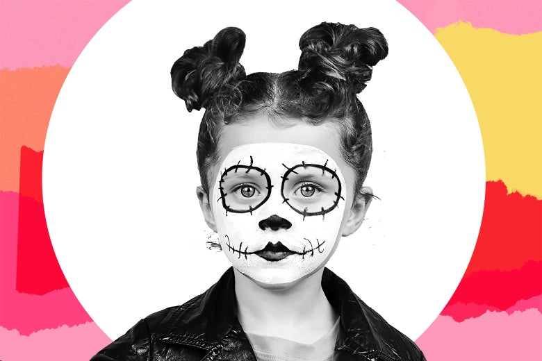 Young girl wearing skull face paint