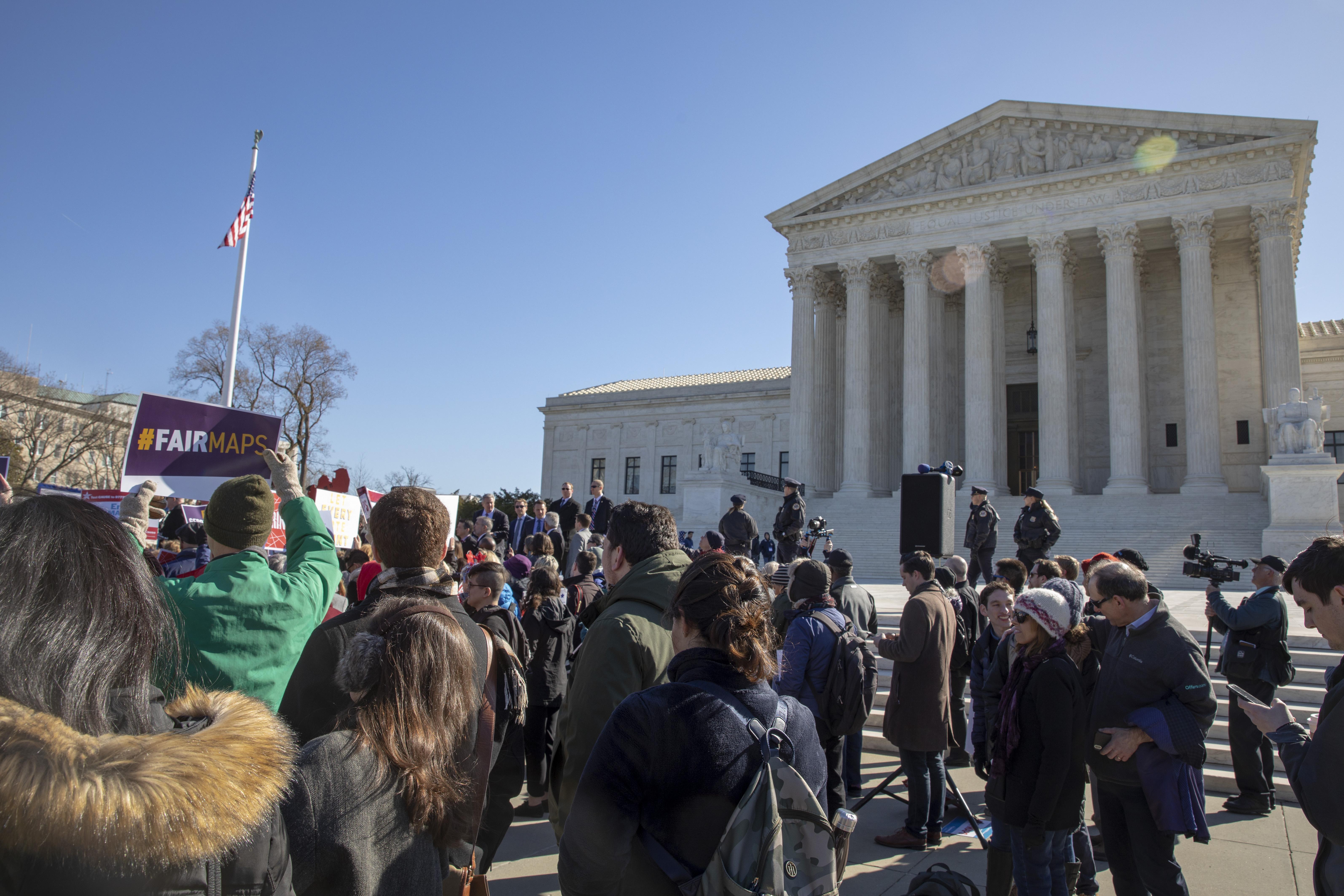 Protesters rally outside the Supreme Court.