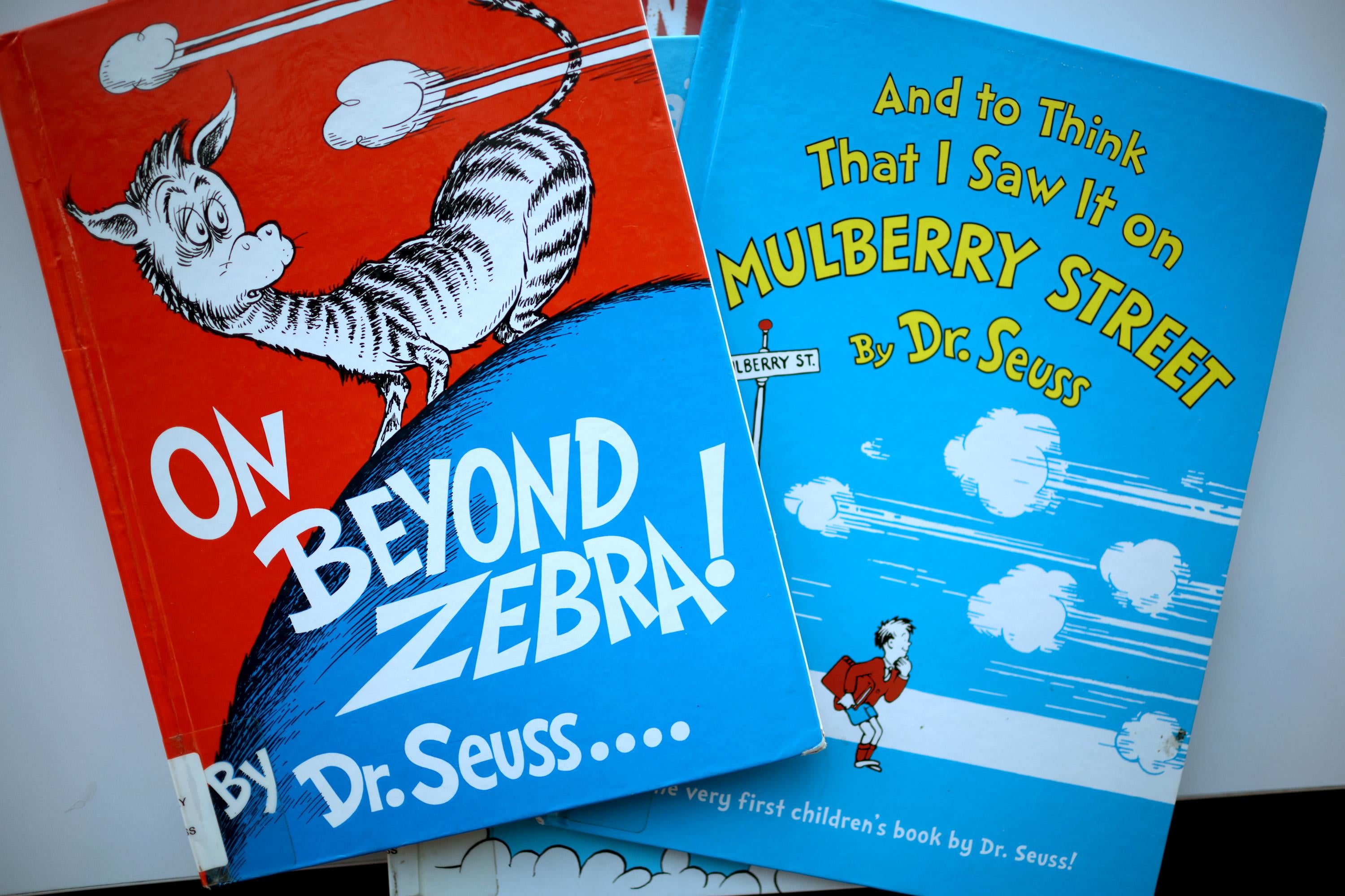 The covers of the two books, both of which bear Seuss’ classic, colorful style