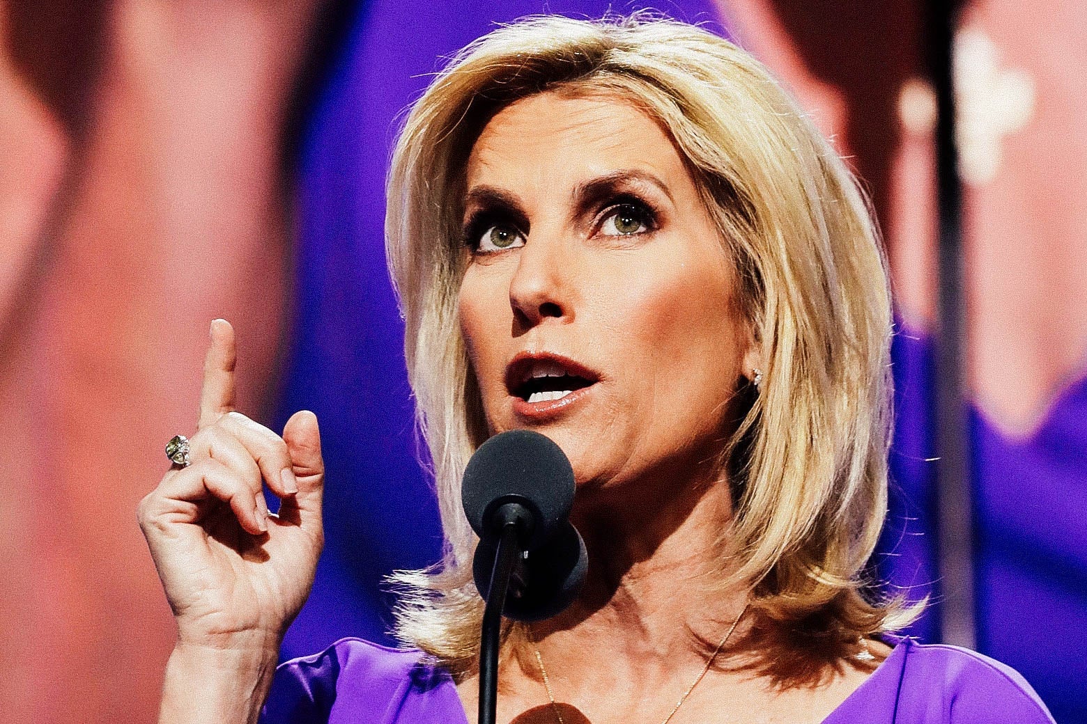 Ingraham pointing as she speaks into a mic onstage.