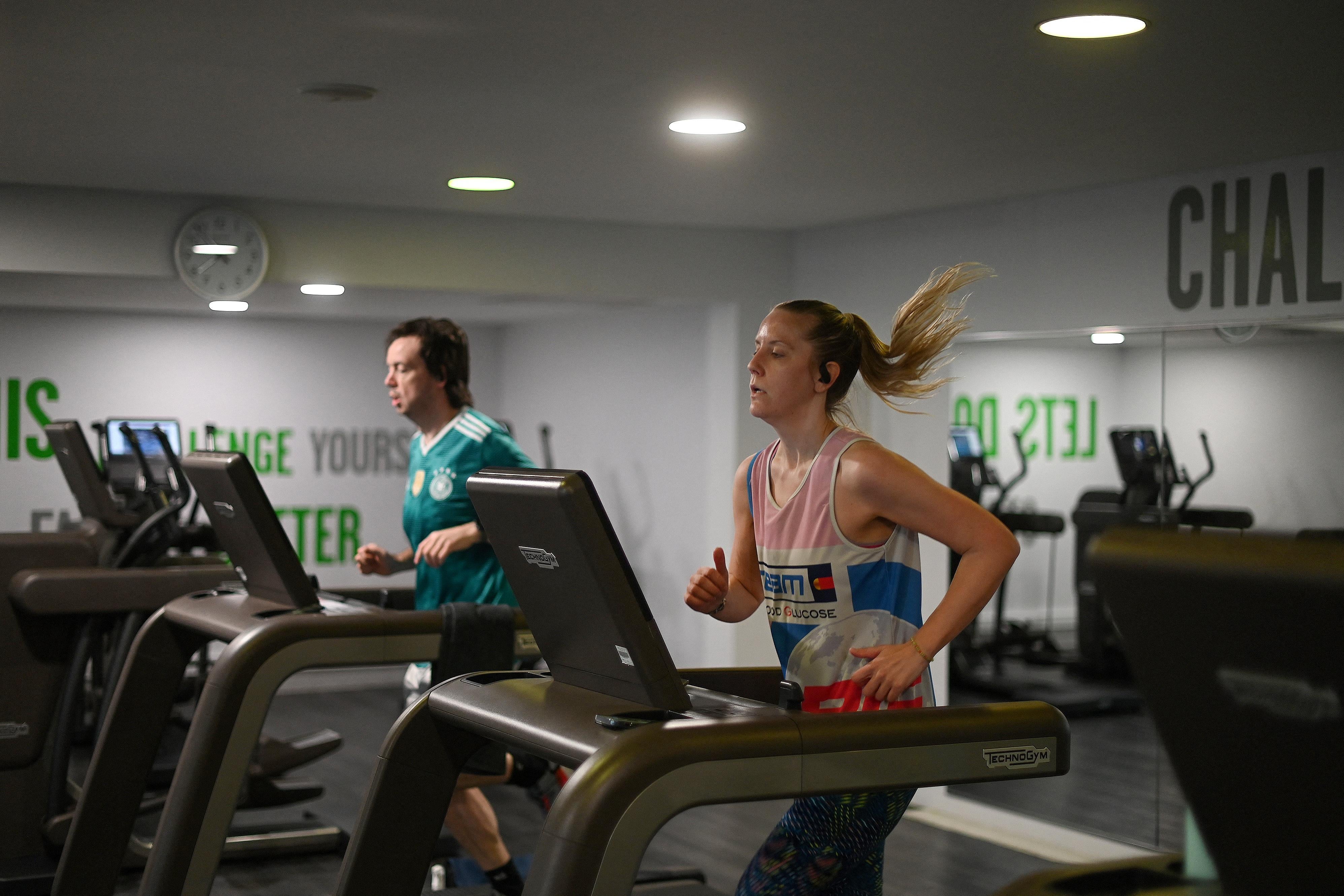 People use the running machines as the indoor gym reopens at Clissold Leisure Centre in north London as coronavirus restrictions are eased across the country following England's third national lockdown, on April 12, 2021.