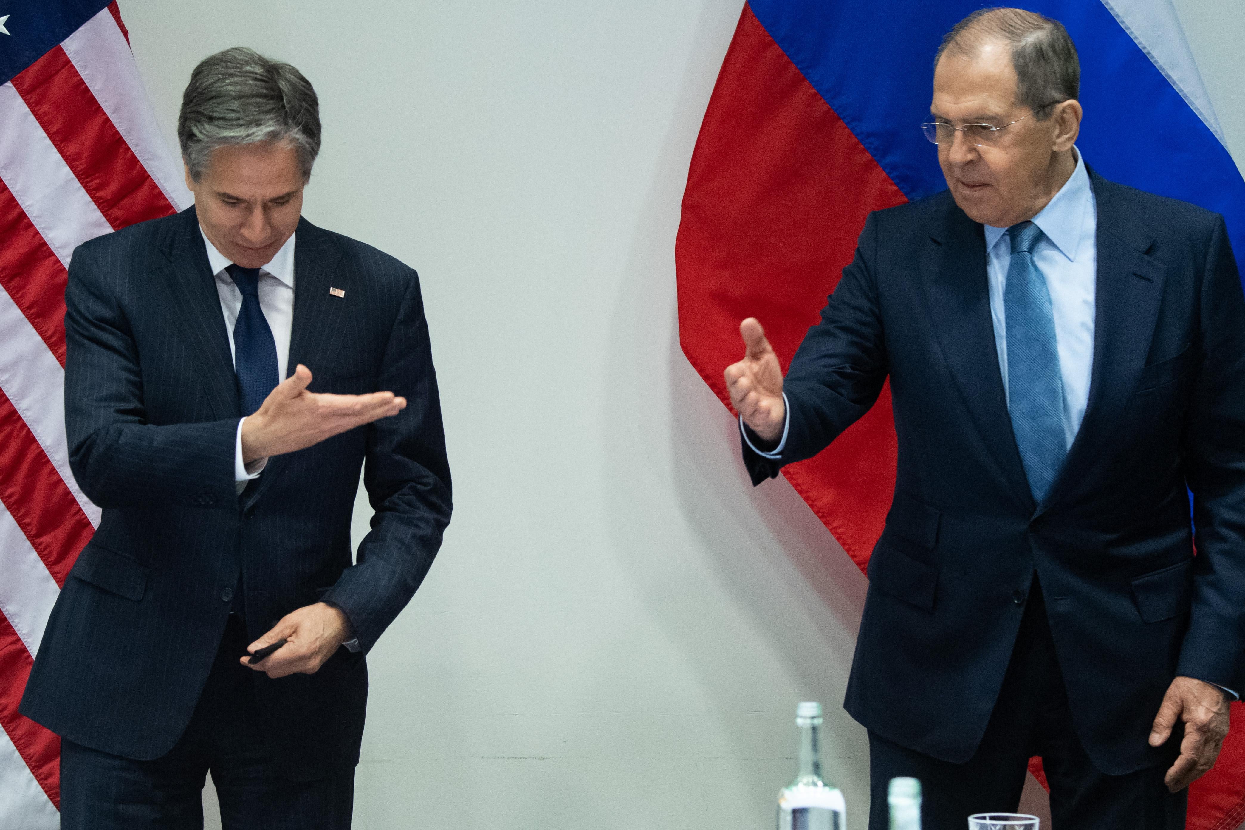 Secretary of State Blinken and Russian Foreign Minister Lavrov stand and gesture before they meet in Reykjavik, Iceland.