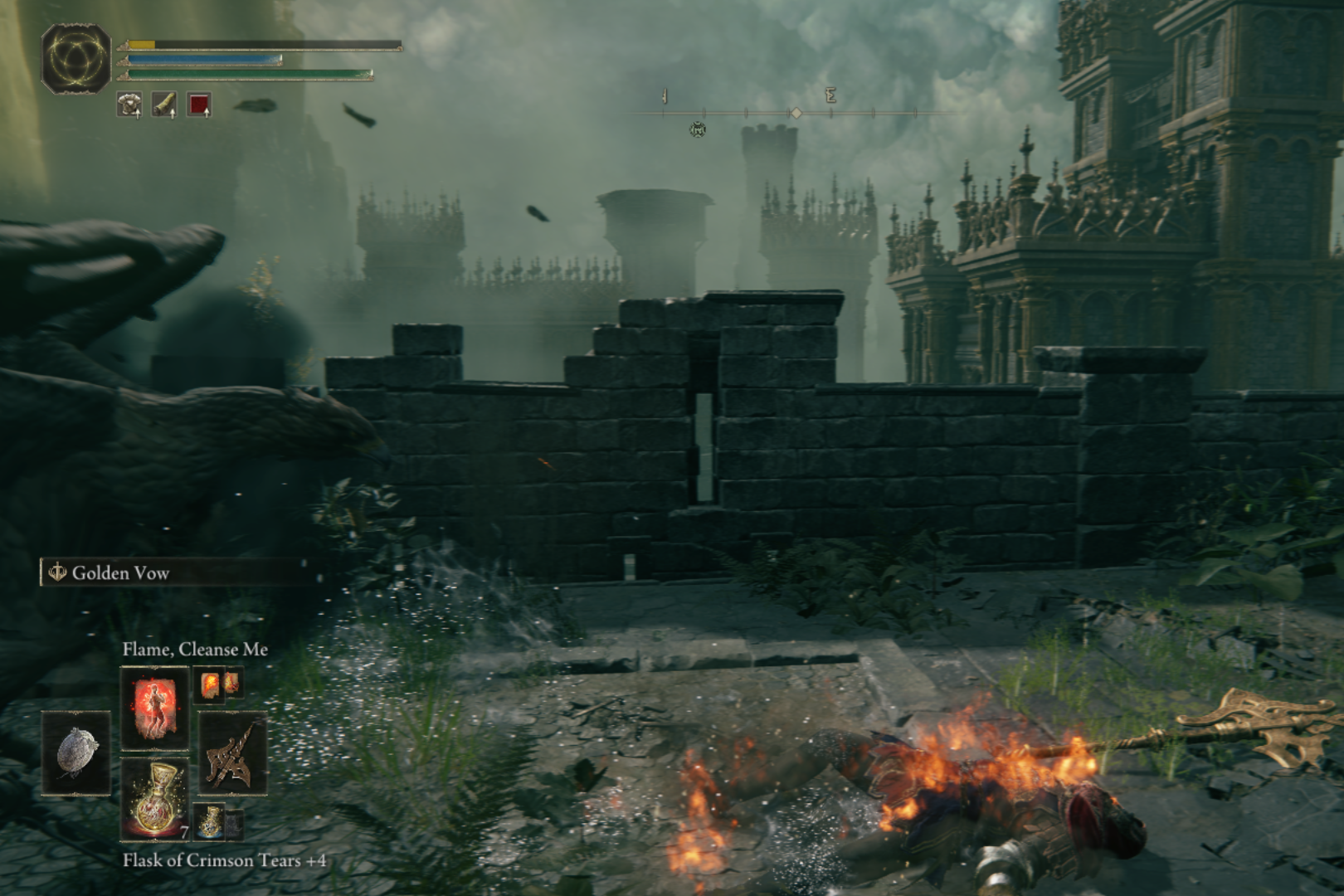 Screengrab of a man lying on the grounds of a castle burning to death