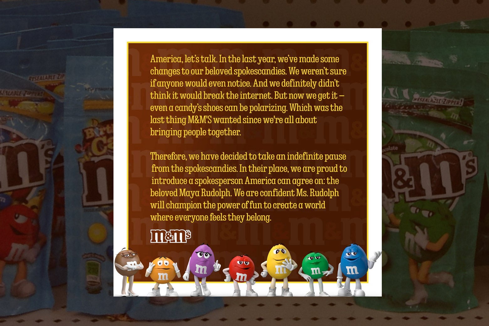 A tweet retracting the use of the M&M spokescandies, superimposed over a background of M&Ms packages. 