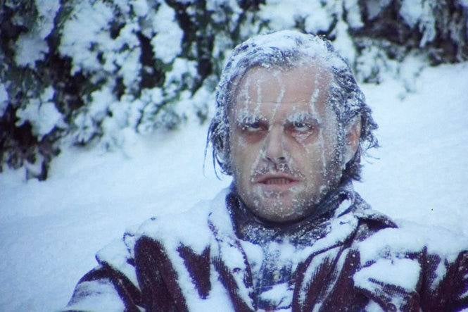Jack Nicholson as Jack Torrance in The Shining, sitting in a hedge maze frozen to death, with snow and ice covering his face and clothes