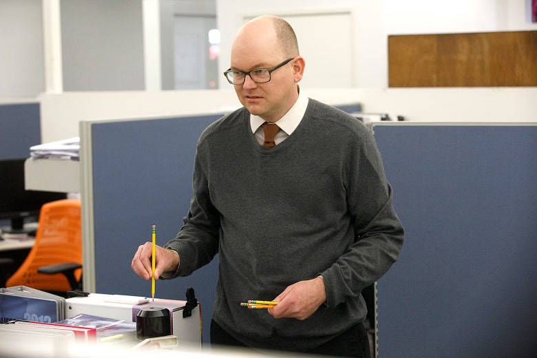 Mark Proksch as Colin Robinson, who is about to sharpen a pencil in this still from What We Do in the Shadows.