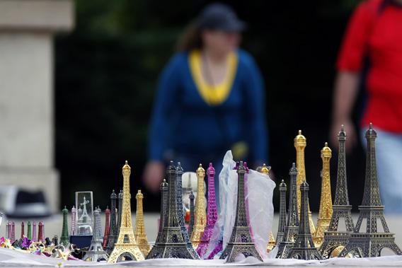 Eiffel tower models are displayed for tourists by a souvenir vendor at the Trocadero in Paris July 26, 2011.