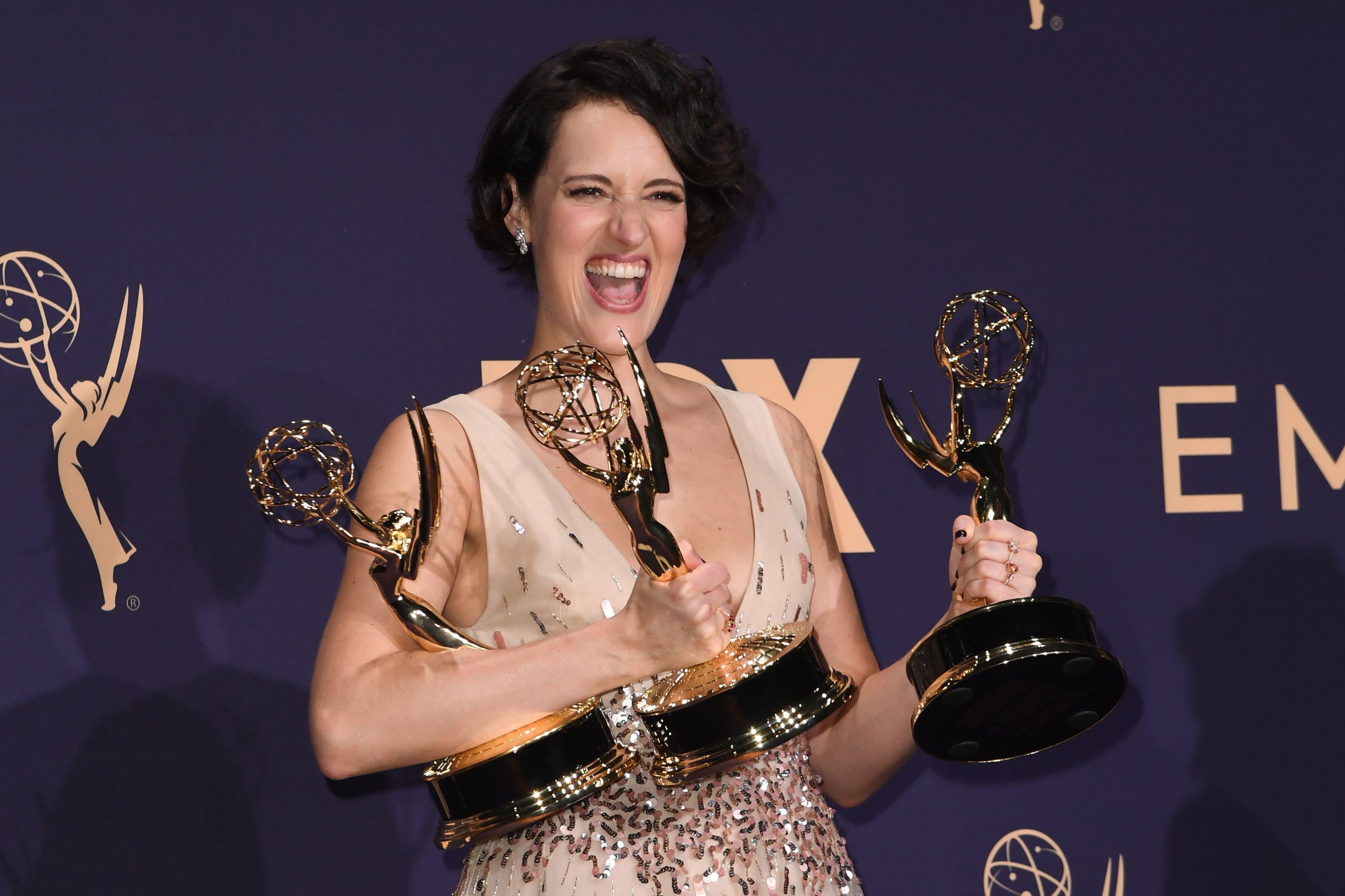British actress Phoebe Waller-Bridge poses with the Emmy for Outstanding Writing for a Comedy Series, Outstanding Lead Actress In A Comedy Series and Outstanding Comedy Series for "Fleabag" during the 71st Emmy Awards at the Microsoft Theatre in Los Angeles on September 22, 2019. (Photo by Robyn Beck / AFP)        (Photo credit should read ROBYN BECK/AFP/Getty Images)