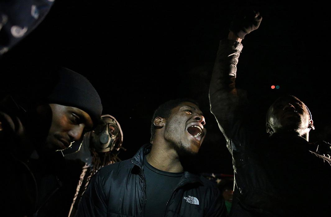 Protesters demonstrate in front of the Ferguson, Missouri, police station on Nov. 25, 2014