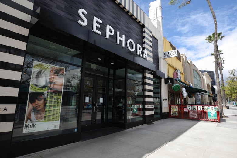 A makeup store on an empty sunny street.