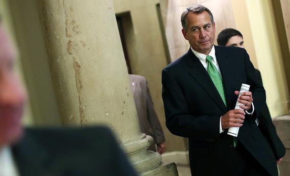 Speaker of the House John Boehner (R-OH) walks to the House chamber to speak on the pending 'fiscal cliff'.