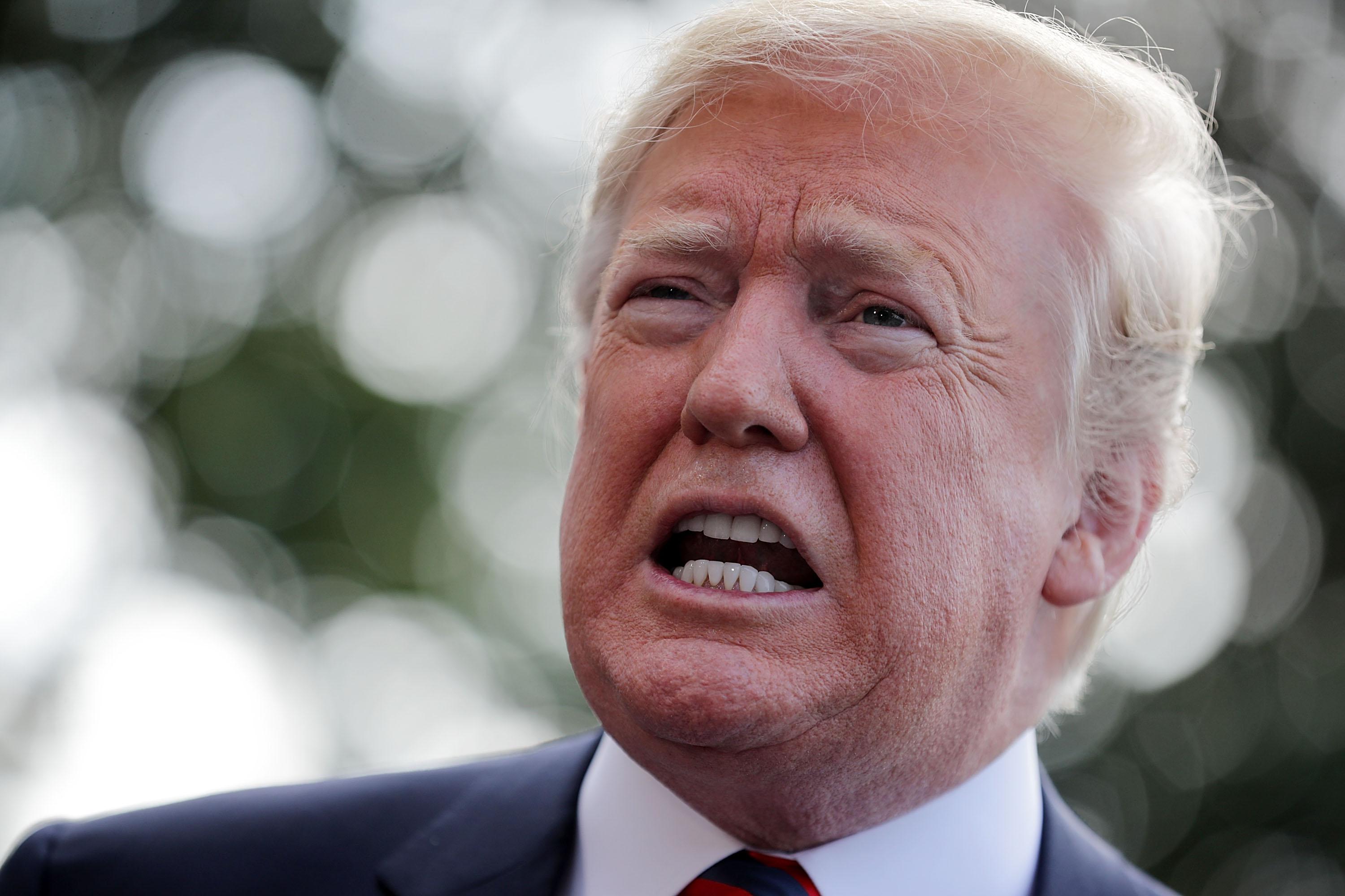 WASHINGTON, DC - JUNE 08:  U.S. President Donald Trump talks to reporters as he departs the White House June 8, 2018 in Washington, DC. Trump is traveling to Canada to attend the G7 summit before heading to Singapore on Saturday for a planned U.S.-North Korea summit.  (Photo by Chip Somodevilla/Getty Images)
