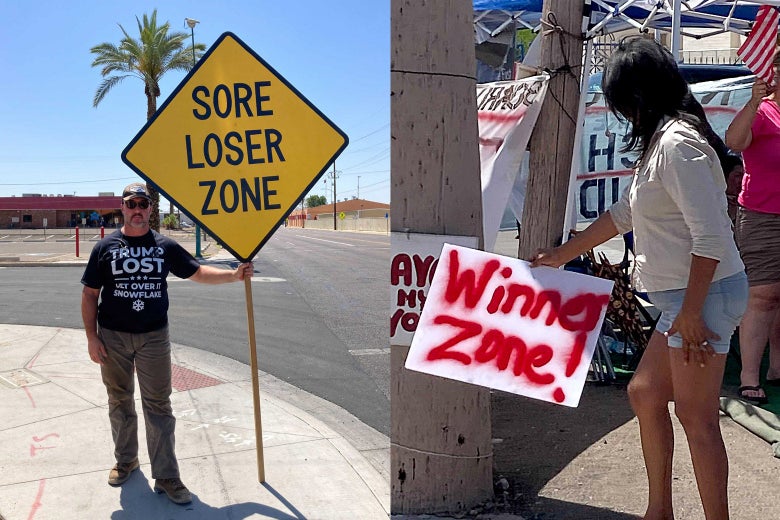 A man with a "SORE LOSER ZONE" sign and a woman with a "WINNER ZONE" sign.