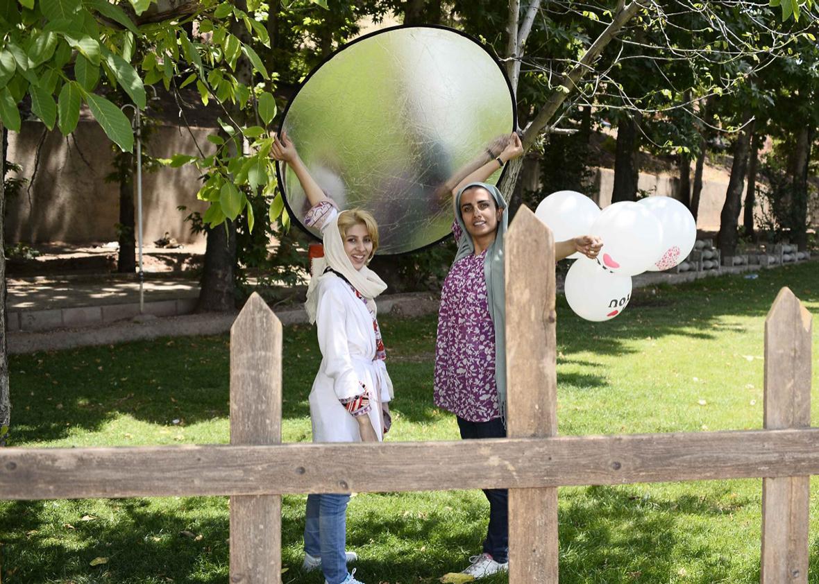 Somayeh Pakar (right) and her assistand at an outdoor wedding photoshoot.