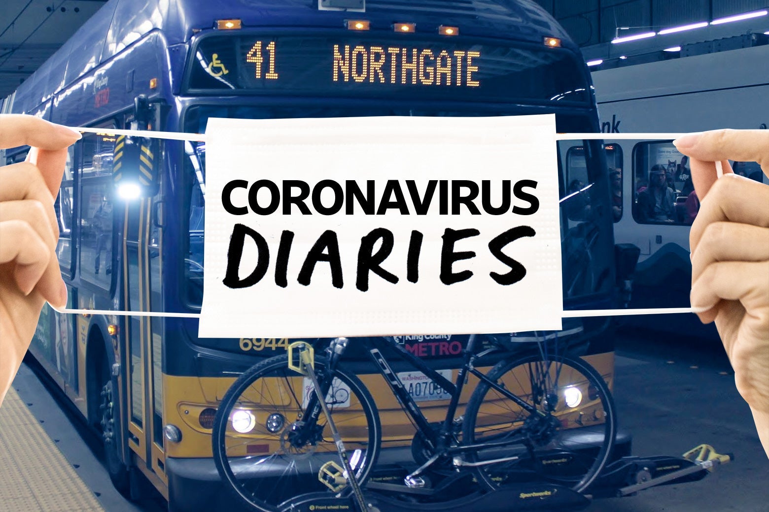 Two hands holding a surgical mask that says "Coronavirus Diaries" over a Seattle bus.