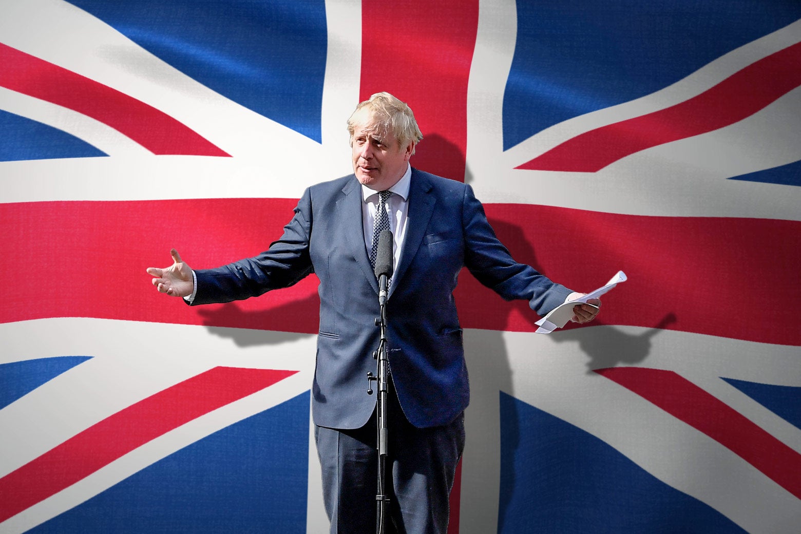 Boris Johnson flanked by the British flag. 