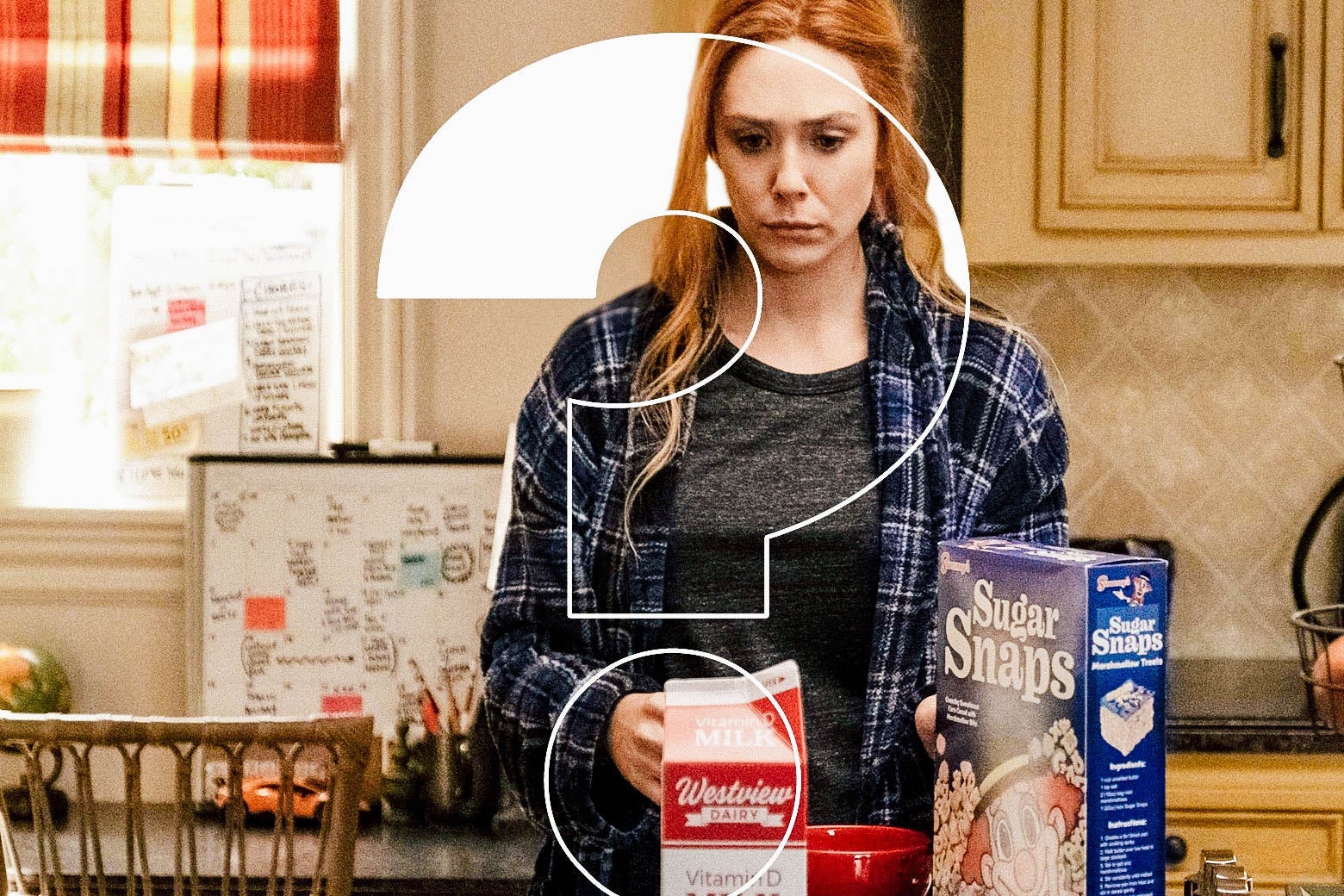 Elisabeth Olsen as Wanda, looking confused in 21st-century pajamas in the kitchen, with a big ol' question mark photoshopped over her