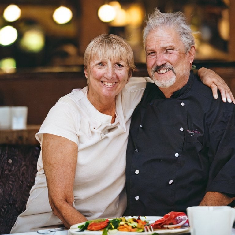A smiling couple in a restaurant.