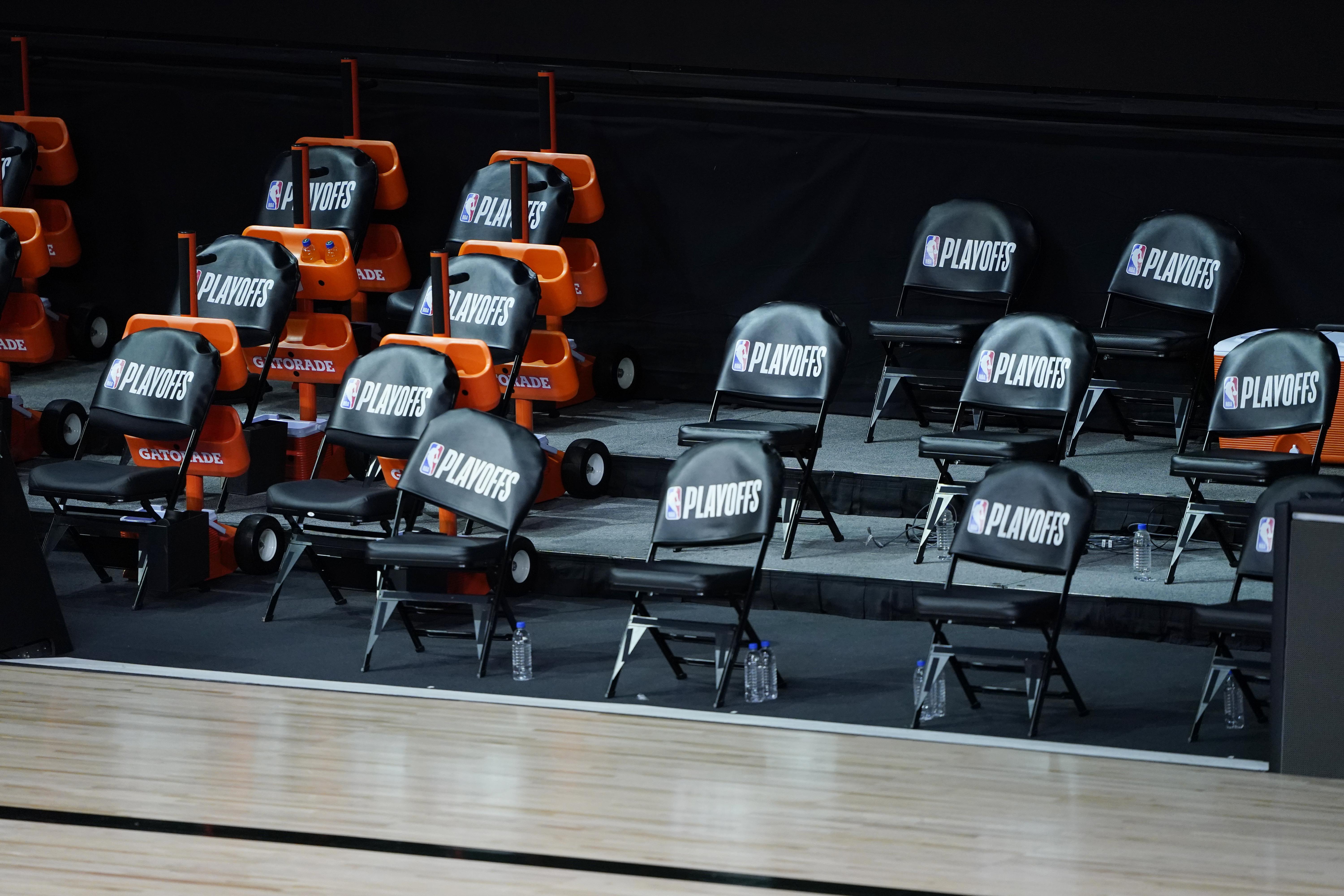 The Milwaukee Bucks’ empty courtside chairs