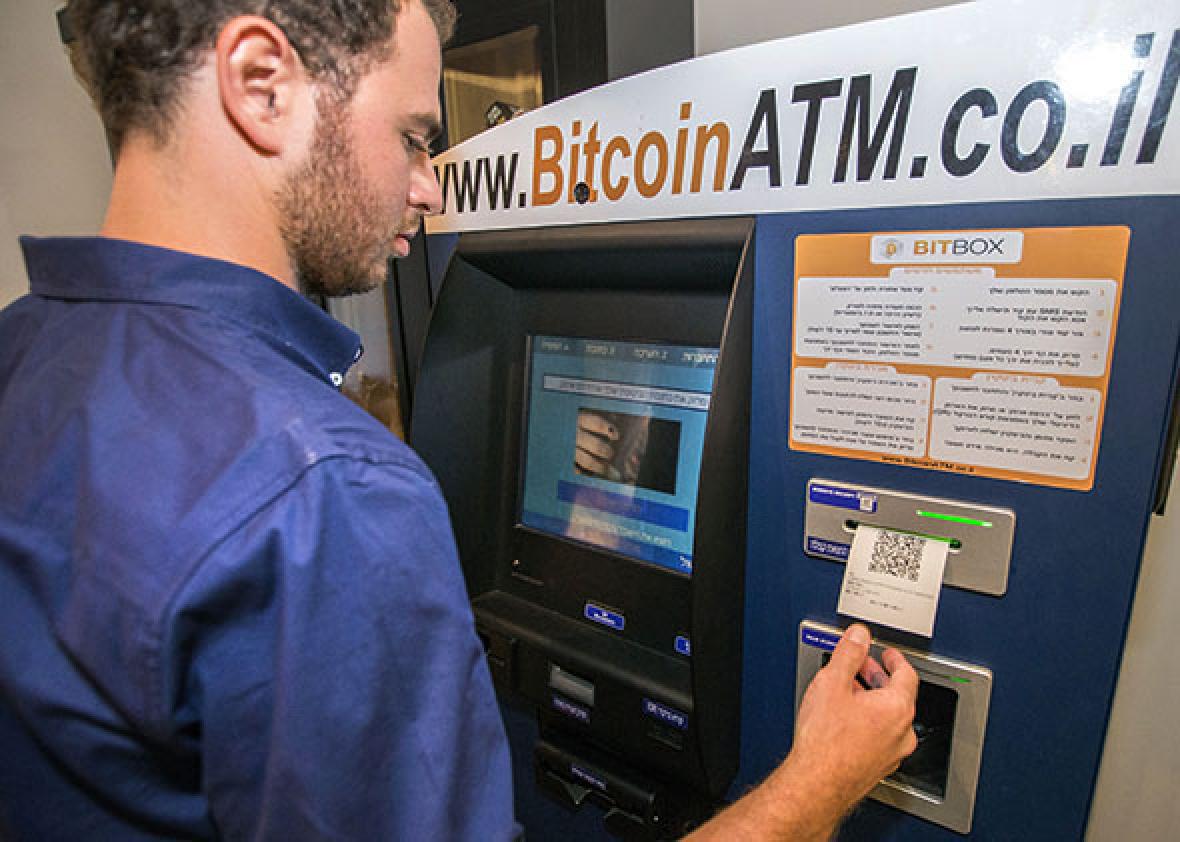 Above, an Israeli man buys bitcoins at a bitcoin ATM in Tel Aviv, on June 11, 2014.