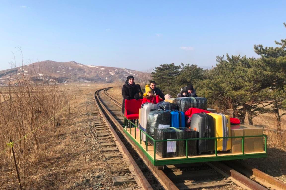 The video shows Russian diplomats pushing the train tram across the border with North Korea.