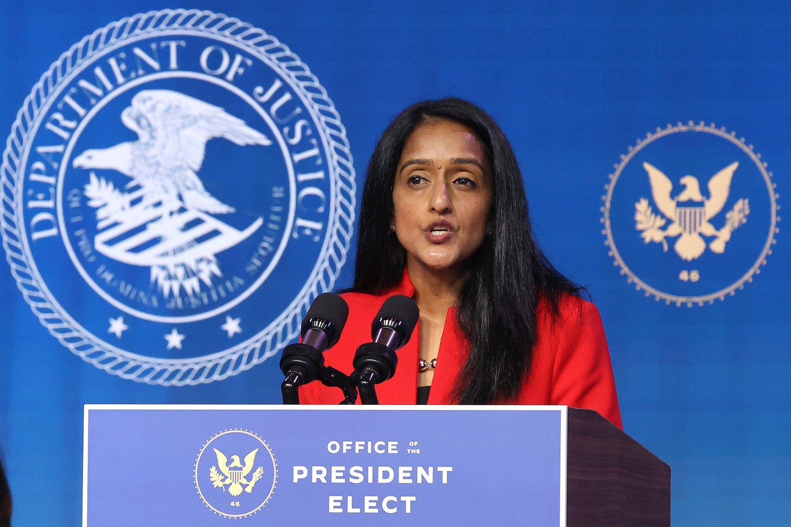 Vanita Gupta speaks at a lectern.