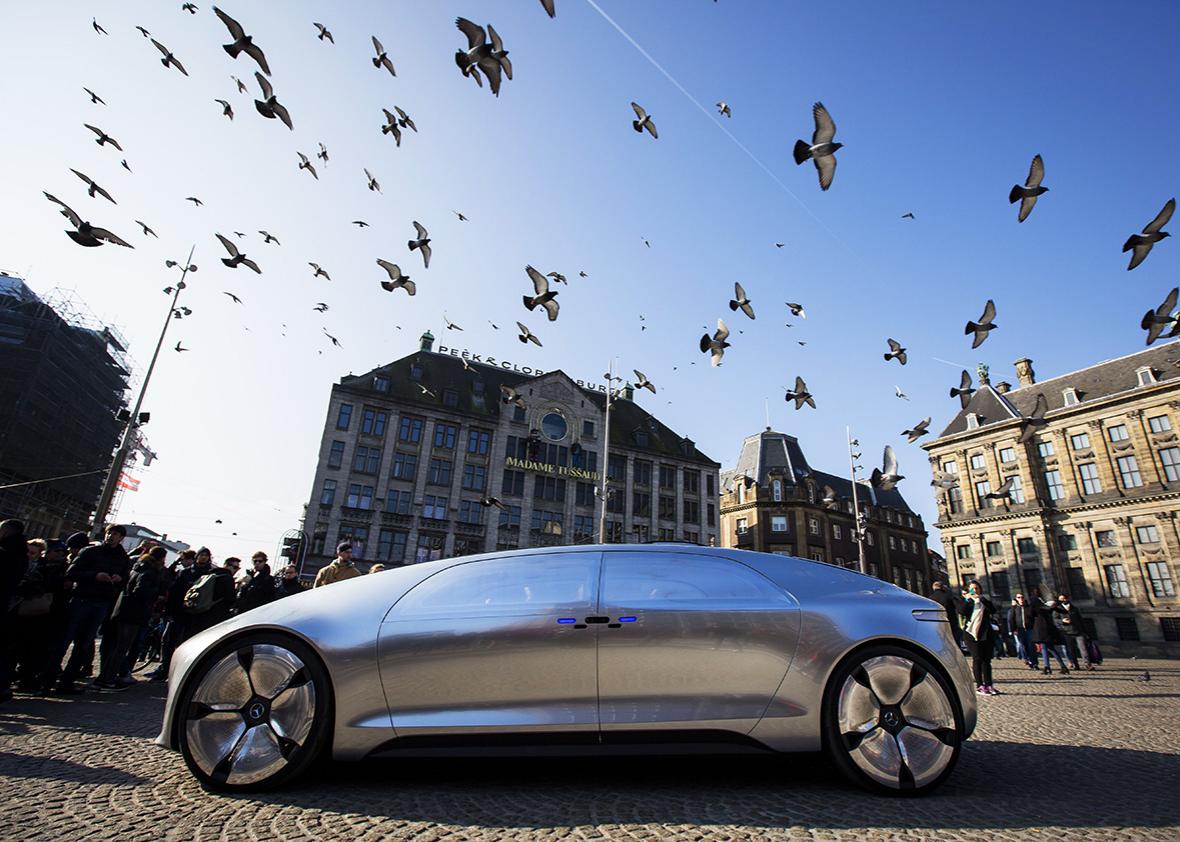 The Mercedes Benz F 015 self-driving stands on March 13, 2016 at the Dam square in Amsterdam. 