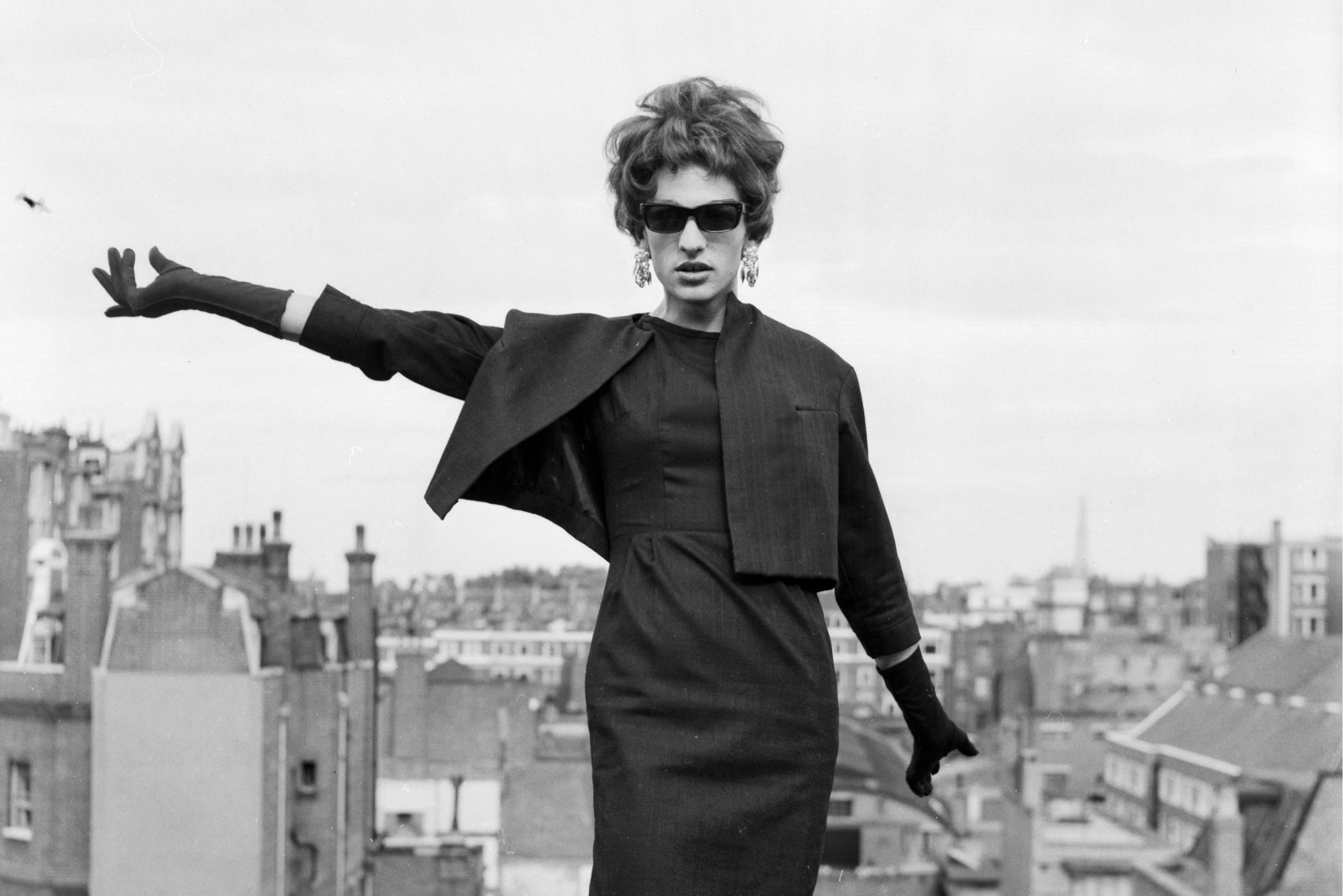 A drag queen posing on a rooftop in London, England.
