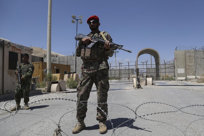 An Afghan National Army (ANA) soldier stands guard at Bagram Air Base.