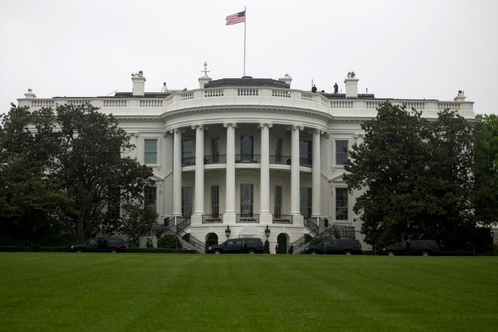 The White House and its lawn, photographed straight on.