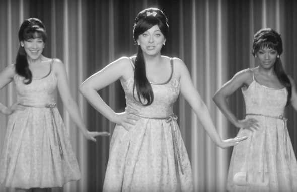 Rachel Bloom and backup dancers wear 1960-style hairdos