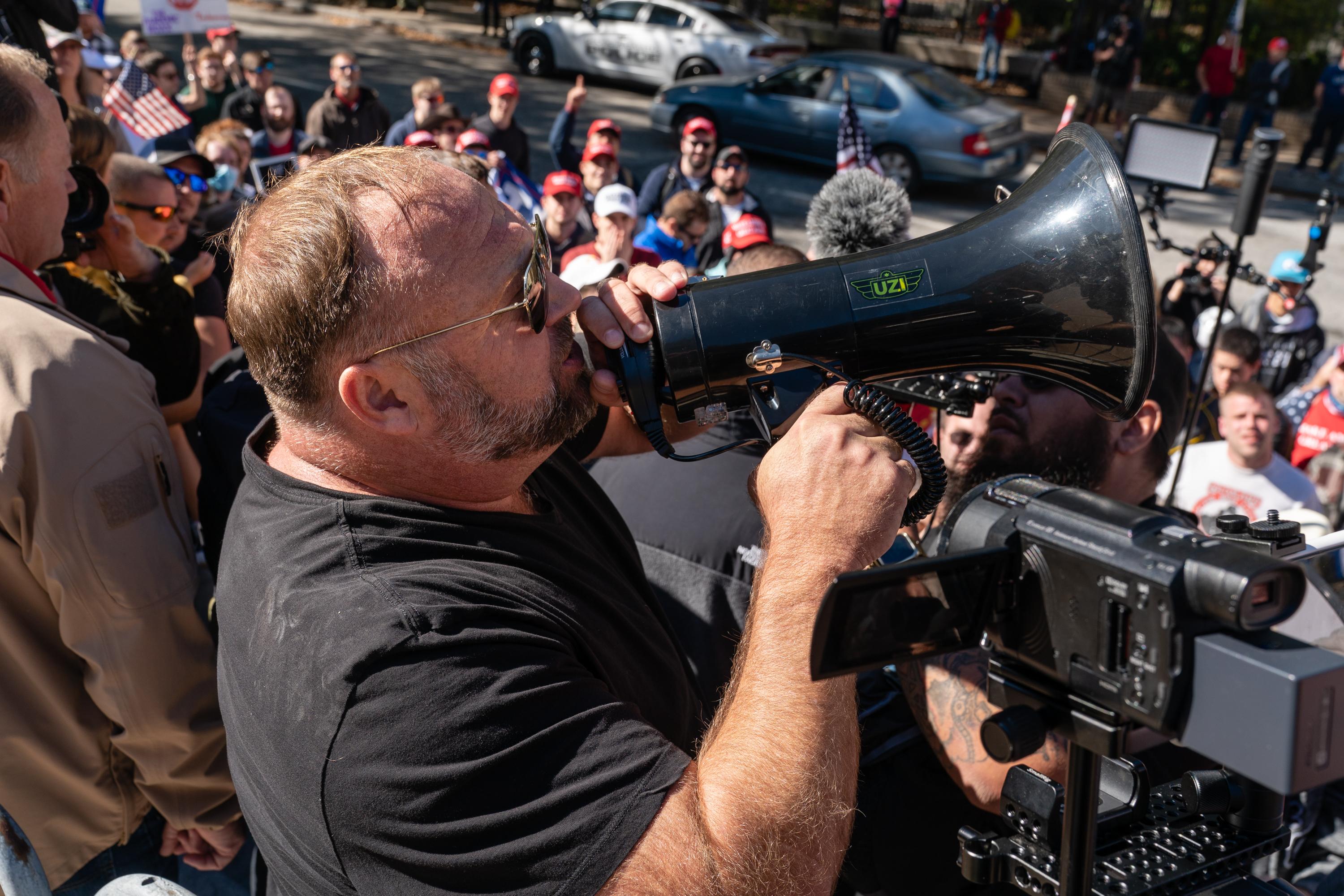 Alex Jones, host of Infowars, an extreme right-wing program that often trafficks in conspiracy theories, speaks during a rally against the results of the U.S. Presidential election outside the Georgia State Capitol on November 18, 2020 in Atlanta, Georgia.